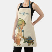  blond meisje met een kinderongeluk dat telefonisc schort (Insitu)