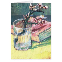Blossombere amandeltak in een glas en een boek