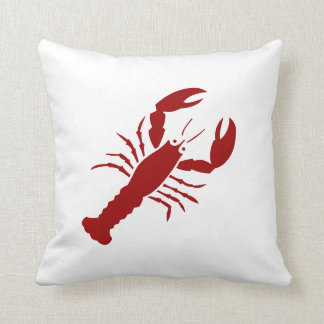 BLOSTER rouge sur coussin blanc