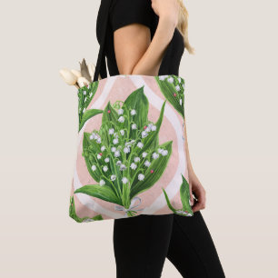 Boeket van lelie van de vallei bloemen op roze draagtas