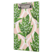 Boeket van lelie van de vallei bloemen op roze klembord (Links)