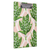 Boeket van lelie van de vallei bloemen op roze klembord (Rechts)