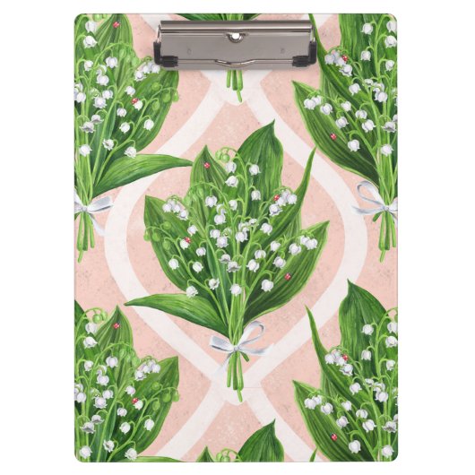 Boeket van lelie van de vallei bloemen op roze klembord (Voorkant)