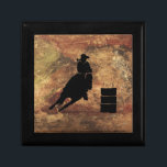 Boîte À Souvenirs Barrel Racing Girl Silhouette on a Grunge Texture<br><div class="desc">Illustration passionnante et rustique sur le thème du rodéo. Silhouette d'un tonneau de cow-girl qui courait avec son cheval. Arrière - plan est une texture grossière brun et rouge tonique patiné. Idéal pour les amateurs de rodéo et de cheval.</div>