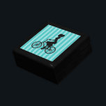 Boîte À Souvenirs Silhouette cycliste pour fille rétro<br><div class="desc">Une jolie illustration graphique rétro. Une silhouette d'une femme en queue de cheval,  portant une robe et faisant du vélo. L'arrière - plan est une motif rayée bleu turquoise avec alternance de tons clairs et sombres.</div>