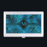 Boîtier Pour Cartes De Visite Palmes noires Turquoise Monogramme<br><div class="desc">Face de palmier tropicale en bleu turquoise sur noir, ce porte-carte est idéal pour les cartes de visite, les cartes de crédit, les cartes cadeaux, et dispose de votre monogramme en lettrage chic sur le devant. Créez-vous pour vous-même ou offrez-en un cadeau. MATCHING coque iphone, d'autres coques ipad et plus...</div>