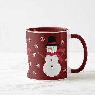 Bonhommes de neige mignons et tasse rouge de fête