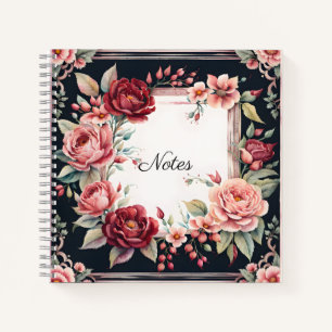Bordeauxrode en roze bloemen op zwart notitieboek
