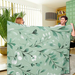 Botanisch patroon in subtiele groentinten fleece deken