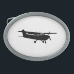 Boucle De Ceinture Ovale Vol noir classique de silhouette de Cessna<br><div class="desc">Un vol de silhouette de Cessna d'avions pour n'importe quel enthousiaste d'aviation, customisent ceci avec le texte et votre choix de couleur d'arrière - plan. Changez facilement la couleur de cet arrière - plan de conception du blanc de préréglage en n'importe quelle couleur de votre choix dans une étape. Cliquez...</div>