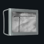 Boucle De Ceinture Rectangulaire Grue de construction et ciel photo noir et blanc<br><div class="desc">Bien au-dessus d'un bâtiment, une grue de construction attend sa prochaine tâche. La grue ressemble à un T à flanc, son bras noir étroit s'étirant à droite de la photo. Une gamme de supports triangulaires à l'aspect délicat mais trompeuse forme l'intérieur de la grue comme le pont que j'ai construit...</div>