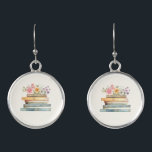 Boucles D'oreilles Livres floraux<br><div class="desc">Montrez votre amour pour la littérature avec la pile de Fleur sauvage et de livres de boucles d'oreilles, un accessoire charmant et élégant pour les amateurs de livres et les épouses-à-être. Dotés d'une délicate aquarelle peinte à la main illustrant des livres vintages en rose, bleu, vert et or, ces boucles...</div>