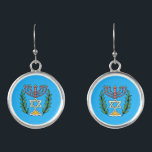 Boucles D'oreilles Persian Magen David Menorah<br><div class="desc">Cette image a été adaptée à partir d'un carrelage juif perse antique et présente une menorah avec un Magen David (Étoile de David) encadré de branches d'olivier. Les imperfections de l'image originale peinte à la main ont été conservées. Ajoutez votre propre texte et vous pouvez modifier la couleur de l'arrière...</div>