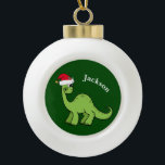 Boule En Céramique Cute Dinosaur Père Noël Vert Enfants Monogramme<br><div class="desc">Dinosaure vert magnifique souriant et très mignon dans un chapeau de Noël rouge vacances. J'aime les animaux de Noël préhistoriques et les cadeaux amusants que les enfants vont aimer. Customisez ce cadeau avec le nom du destinataire pour le rendre encore plus personnalisé.</div>