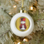 Boule En Céramique Red Snowman sur Gold Christmas<br><div class="desc">Un joli ornement d'arbre de Noël avec un bonhomme de neige vêtu d'un chapeau et d'un gilet en velours rouge,  fixé sur l'or et entouré d'étoiles d'or pour ajouter un peu de pétillant festif à votre maison cette saison de vacances.</div>