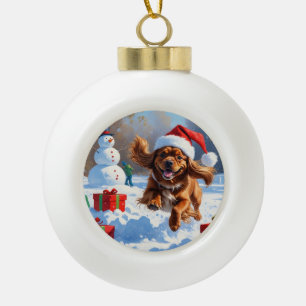 Boule En Céramique Tibétain Spaniel courant dans la neige avec un cha