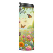 Bouteilles Isothermes Armadillo dans un jardin fleuri (Tourné sur la droite)