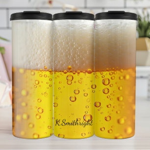 Bouteilles Isothermes Bière dorée gros plan mousse bulles