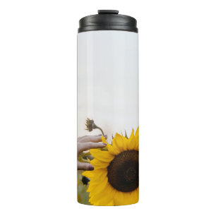 Bouteilles Isothermes Personne tenant du tournesol