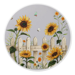 Bouton De Porte En Céramique Fleurs de soleil le long de la clôture blanche