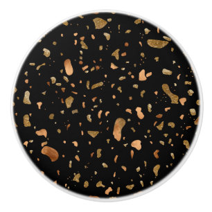 Bouton De Porte En Céramique Or en cuivre sur pierre noire du Terrazzo