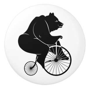 Bouton De Porte En Céramique Silhouette noire d'ours montant un vélo