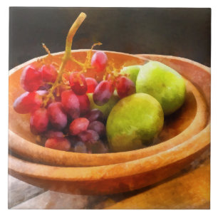 Bowl van rode druiven en peren tegeltje