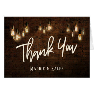 Briques industrielles Merci avec éclairage Edison