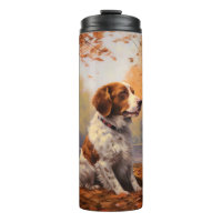 Brittany Spaniel in herfstbladeren val inspireert