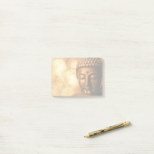 Bronze Boeddha-standbeeld met Golden Bokeh-achterg Post-it® Notes (Op bureau)