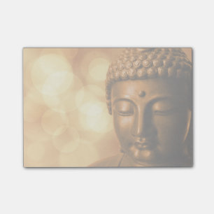 Bronze Boeddha-standbeeld met Golden Bokeh-achterg Post-it® Notes