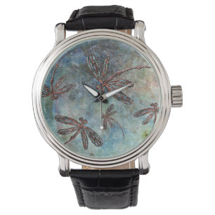 Bronze Tipped Dragonflies op een Magic Sky. Horloge