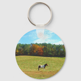 Bruin- en witpaard, herfstbomen, blauwe hemel sleutelhanger