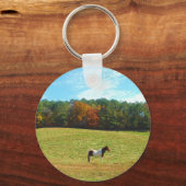 Bruin- en witpaard, herfstbomen, blauwe hemel sleutelhanger (Voorkant)