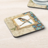 Bruine en blauwe vogel op een bijkantoor die omhoo drankjes onderzetter (Linkerzijde)