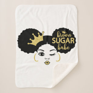 Bruine suikerbaby in zwart en goud sherpa deken