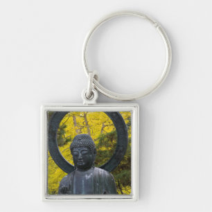 Budda-standbeeld in de Japanse Tuinen Gouden Sleutelhanger