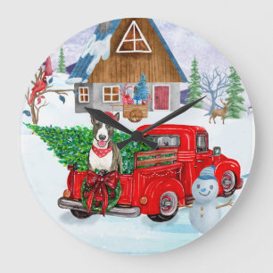 Bull Terrier hond in Kerstbezorgingswagen Sneeuw Grote Klok