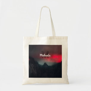 Burning clouds, fog and mountains monogram in sky tote bag