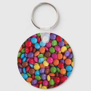 Buttonnen met kleurrijke chocolade sleutelhanger