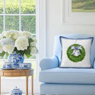 Buxuskrans met blauwe toile strik kussen