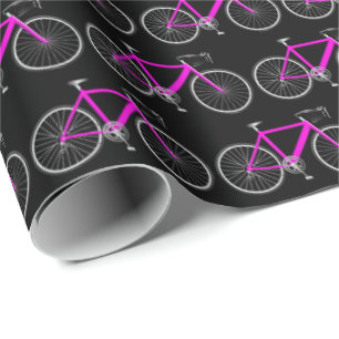 Cadeau bicyclette rose sur papier d'emballage noir