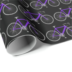 Cadeau bicyclette violette sur papier d'emballage noir