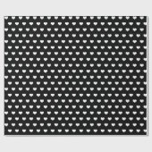 Cadeau coeurs blancs sur papier d'emballage noir (Plat)