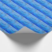 Cadeau main serrée sur papier bleu (Coin)