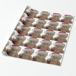 Cadeau Ours de Père Noël avec peu de papier d'emballage