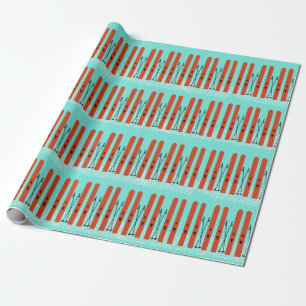CADEAU SKIS ROUGE AVEC NEIGE SUR PAPIER EN WRAPPER BLEU