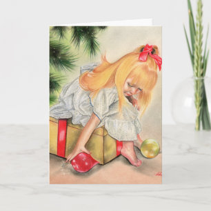 Cadeaux sous la carte de voeux de Noël