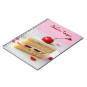 Cahier de recettes de pâtissier avec cerise dessus (Côté gauche)