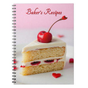 Cahier de recettes de pâtissier avec cerise dessus
